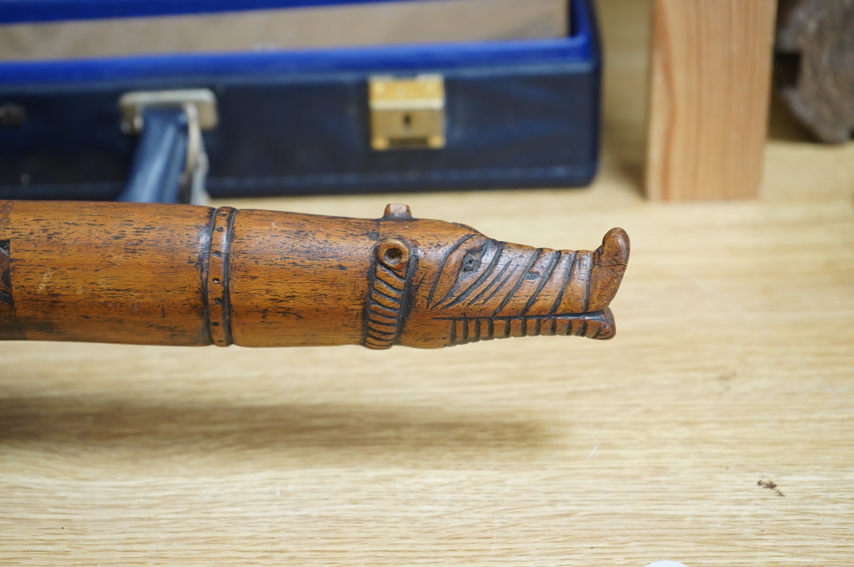 An 18th / 19th century Indian carved wood oil pourer, 43cm